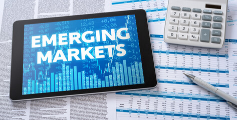 Wall Mural - a tablet with financial documents - emerging markets