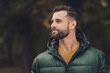 © deagreez - Profile portrait of handsome person look interested far away wearing warm clothing walking outdoors