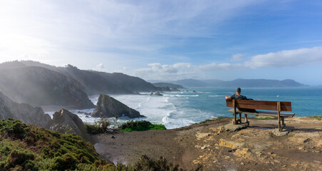 Sticker - man relaxing and enjoying the vie at the cliffs of Loiba in Galicia