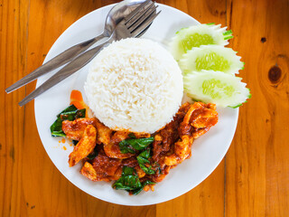 Thai Food one dish meal or Street food from Stir-fried pork with chili paste for lunch or dinner on wooden floor.