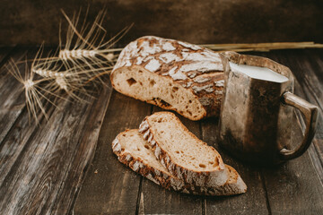 ethnic Breakfast milk and bread on a dark background 