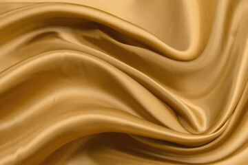Smooth elegant brown silk (satin) abstract fabric texture background.