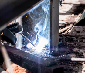 Technician welding steel structure for workshop in Bangkok ,Thailand.