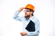 © SHOTPRIME STUDIO - man in shirt orange helmet emotions work official