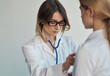 © SHOTPRIME STUDIO - Woman professional doctor with glasses stethoscope patient health