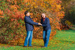 © soleg - couple walking in autumn city park, happy people together, beautiful nature with colorful leaves