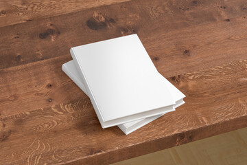 Vertical white hardcover book stack mockup on the wooden table.