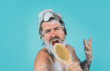 © Svitlana - Man in shower. Man sing in shower. Man with body brush. Shampoo. Head washing. Bearded man washing hair. Hair Care. Spa. Take a shower.