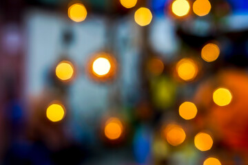 Wall Mural - Abstract blurred and bokeh of party light bubs reflection lighting at night time and blurry background.
