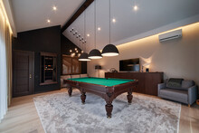 Modern Billiard Room With A Beautiful Table And Large Windows