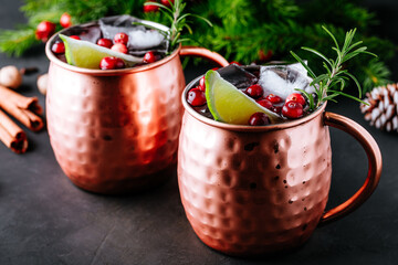 Wall Mural - Moscow Mule cocktail with cranberries in copper mugs for Christmas