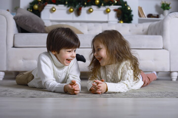 A young family with children decorates the house for the holiday. New Years Eve. Waiting for the new year.