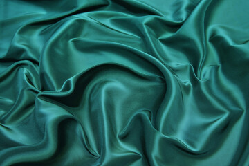 Wall Mural - Soft silk cloth or satin fabric texture. Wrinkled fabric pattern. Tidewater Green is a 2021 Color Trend.