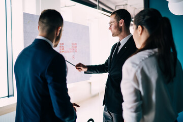 Wall Mural - Attentive business workers discussing strategy