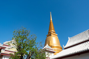 Wall Mural - Wat Bowonniwet Vihara, Bangkok, Thailand under clear blue sky