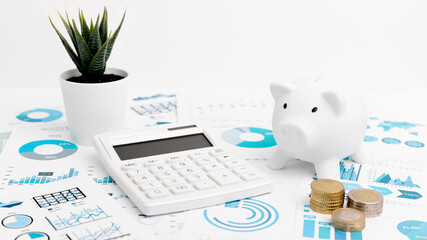 Wall Mural - Accounting concept. Piggy bank, calculator, graph, coins on white background. Banner.