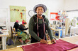 © Micky Wiswedel/Stocksy - African man cutting fabrics in a workshop