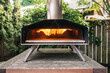© Jen Grantham Photography/Stocksy - Backyard pizza oven
