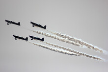Low Angle View Of Fighter Planes Performing Against Clear Sky