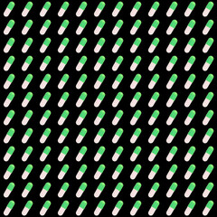 Wall Mural - pattern of green pills on a black background