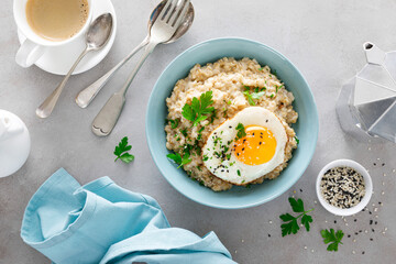 Sticker - Savoury oatmeal with fried eggs sunny side up for breakfast