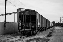 A Small Train And Train Cars Sitting Outside Of The Salt Mines On Lake Erie In Northeast Ohio.