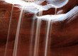 Long Time Exposure Of A Sun Lit Trickle Of Sand In The Upper Antelope Canyon On A Hot Sunny Summer Day