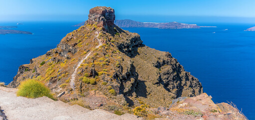 Wall Mural - A winding path leads to Skaros rock from Imerovigli in summertime