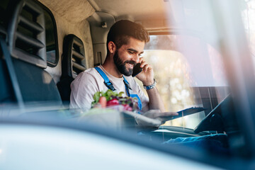 Young and handsome Hispanic male working in daily home delivery service. He is positive and smiled.