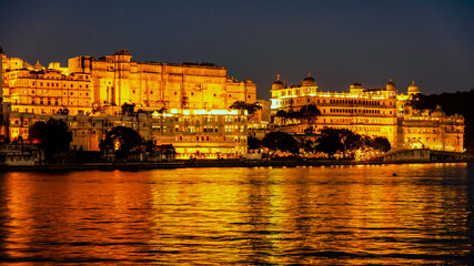 Night view of city palace from Ambrai Ghat at Udaipur, Rajasthan, India