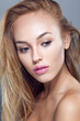 © Dragosh - Closeup beauty portrait of sensual blonde young woman with beautiful makeup, over grey background.
