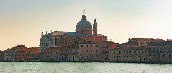 Wall Mural - Water channels of Venice city. Church of the Santissimo Redentore and Galleria Il Redentore buildings are on Grand Canal in Venice, Italy.