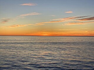 Wall Mural - Orange sunset over the ocean