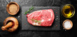 Raw fresh meat Ribeye steak entrecote of Black Angus Prime meat on black background. top view