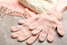 Stylish Pink Gloves, Scarf And Hat On Light Grey Marble Table, Closeup