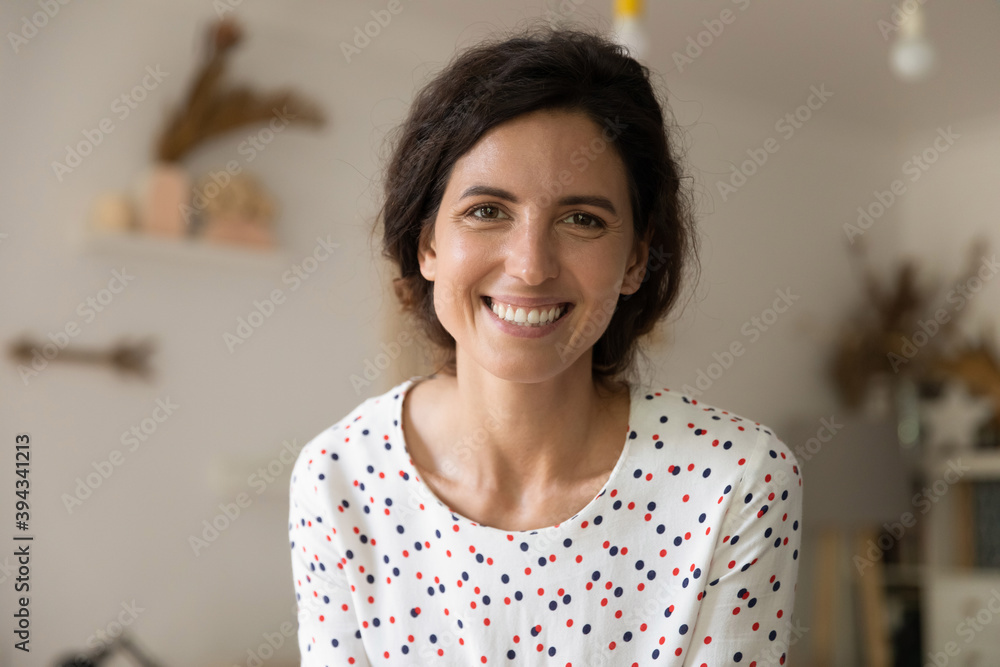 Close up headshot portrait of smiling young Caucasian woman look at ...