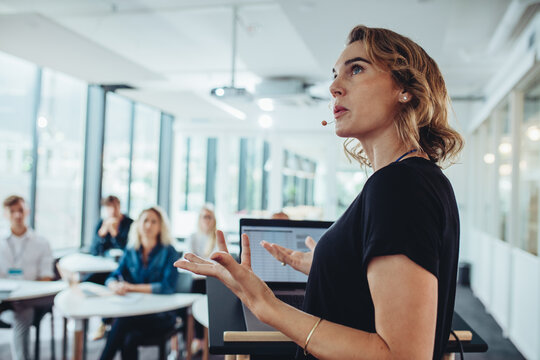 business woman delivering a presentation at a conference