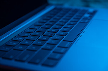 Close-up shot of laptop keyboard . Concept of working, writing e-mails, using Internet.