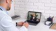 © viacheslav - Woman in laptop screen talk online remote webcam computer. Man doctor wears medical coat wireless earphones sits on chair at desk in hospital office listens patient client writes symptoms in notebook