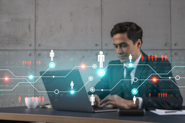 Businessman in office working with laptop, develop networking chain to push new social media project, typing computer. Double exposure.