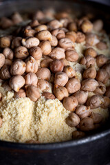 Wall Mural - Chickpea flour and chickpea kernels in the old metal bowl.