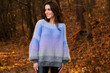 © julijacernjaka - Woman posing in handmade knitted sweater in autumn park