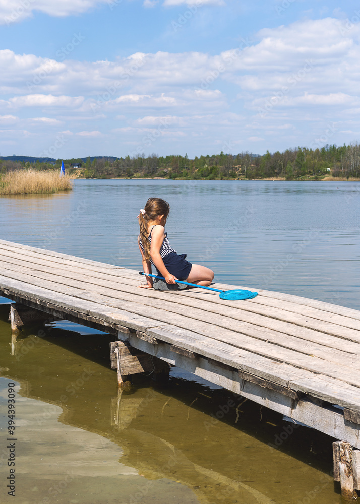 Little girl at the lake Stock Photo | Adobe Stock
