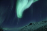 Fototapeta Kosmos - snowy mountain, aurora borealis, northern lights, Norway