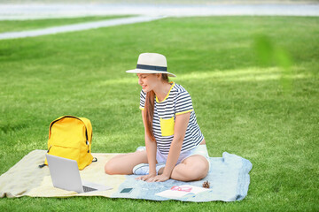 Sticker - Beautiful female student with laptop in park