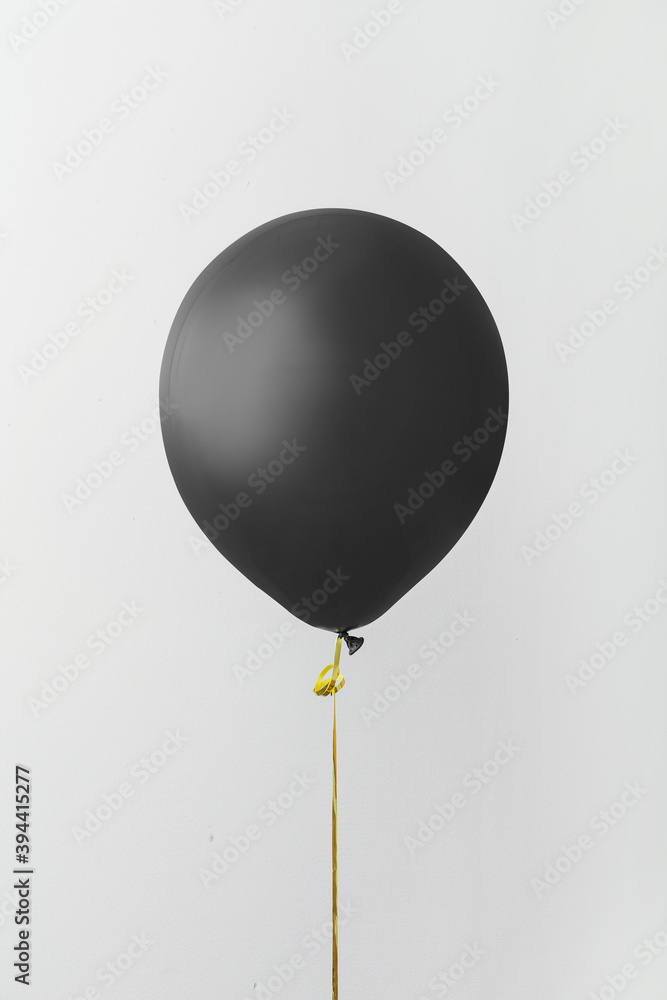 Black air balloon on grey background