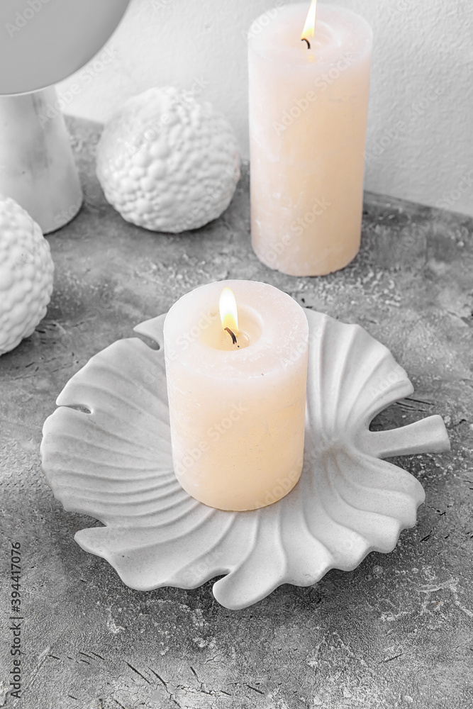 Beautiful aroma candles on grey background