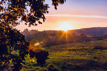 Wall Mural - sunset over the Chianti hills of Siena in Tuscany in autumn