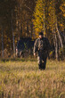 © Пётр Рябчун - Male hunter in camouflage clothes ready to hunt with hunting rifle