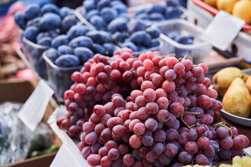 Wall Mural - Counter with plums, grape, pears